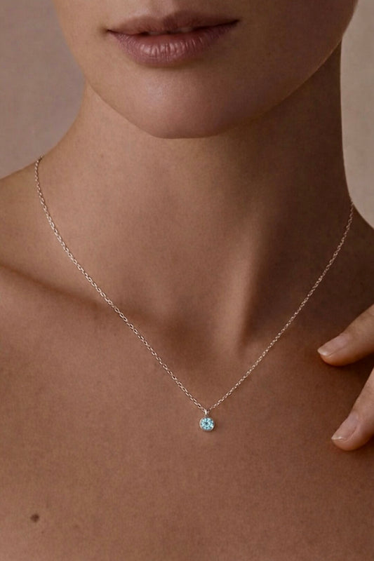 Model wearing personalized birthstone necklace with chosen month gemstone pendant