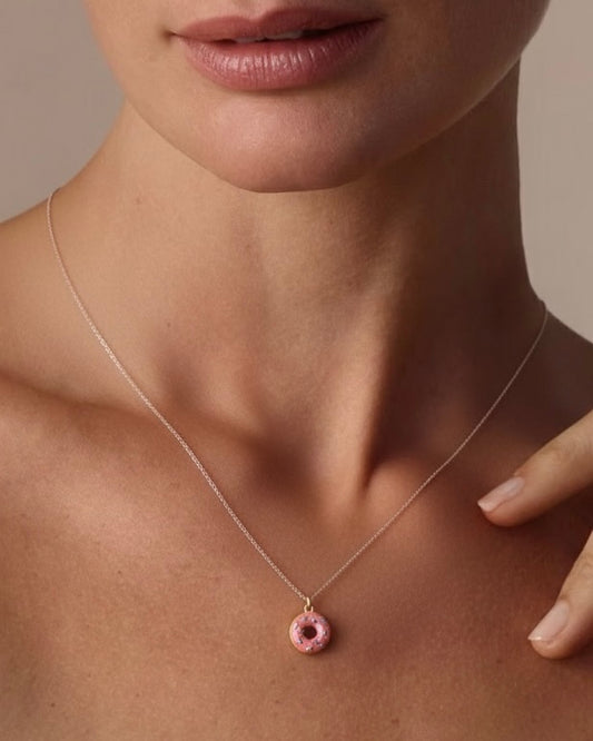 Model wearing donut necklace – fun pink donut charm