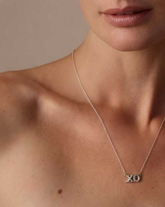 Model wearing "Hugs & Kisses" XO necklace – sweet romantic jewelry