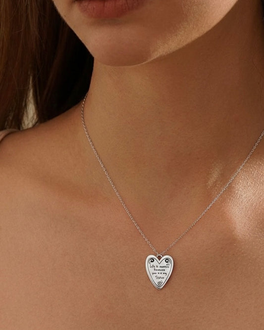 Model wearing sweet sister necklace – adorable heart charm