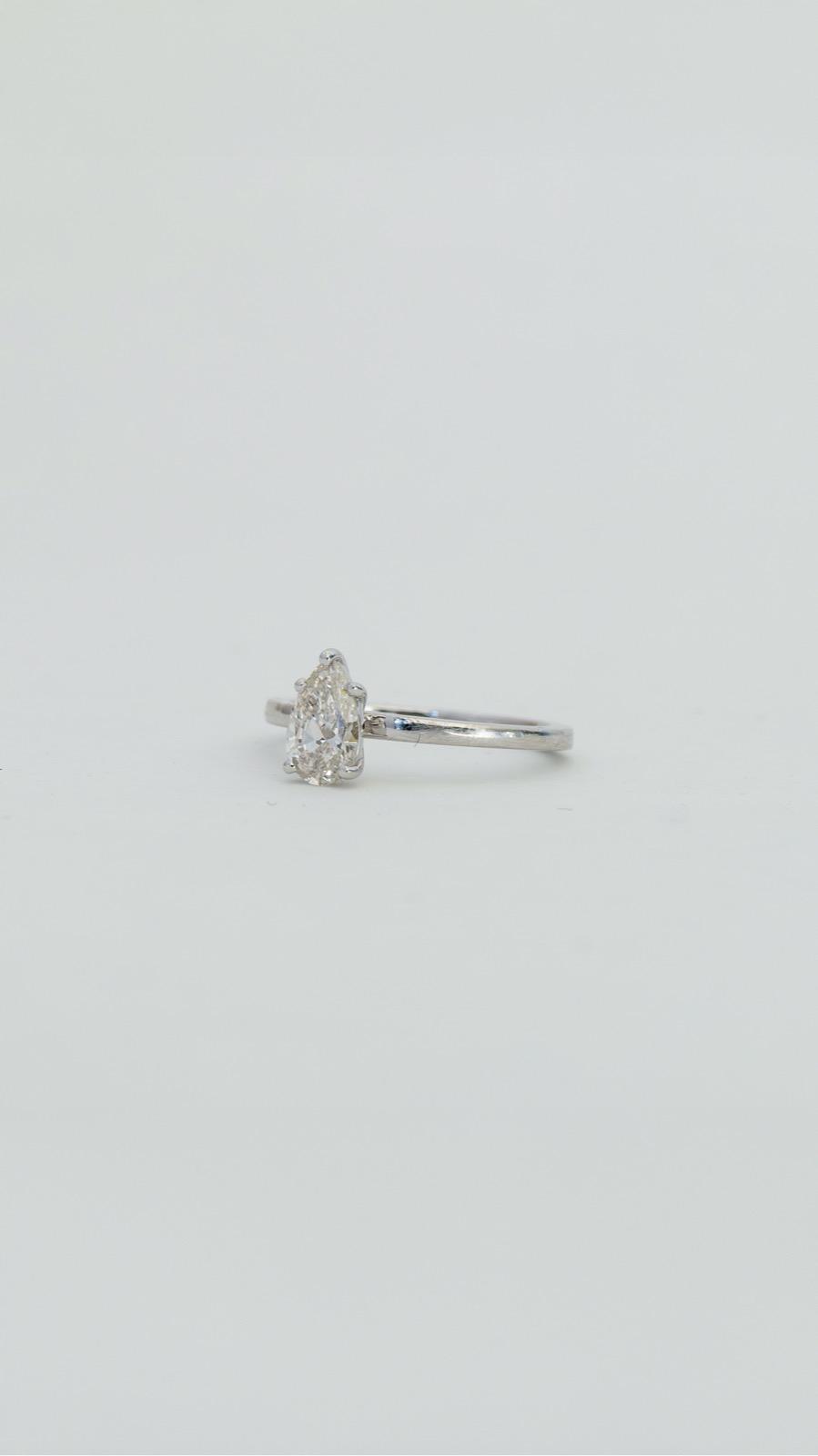 A pear-cut lab-grown solitaire ring