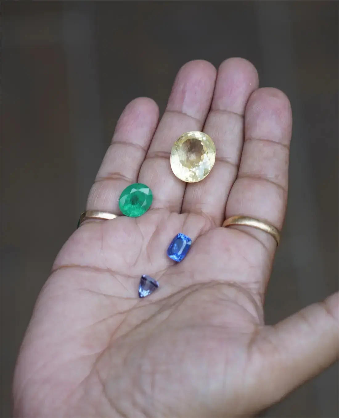 Cut stones in a maker's palm