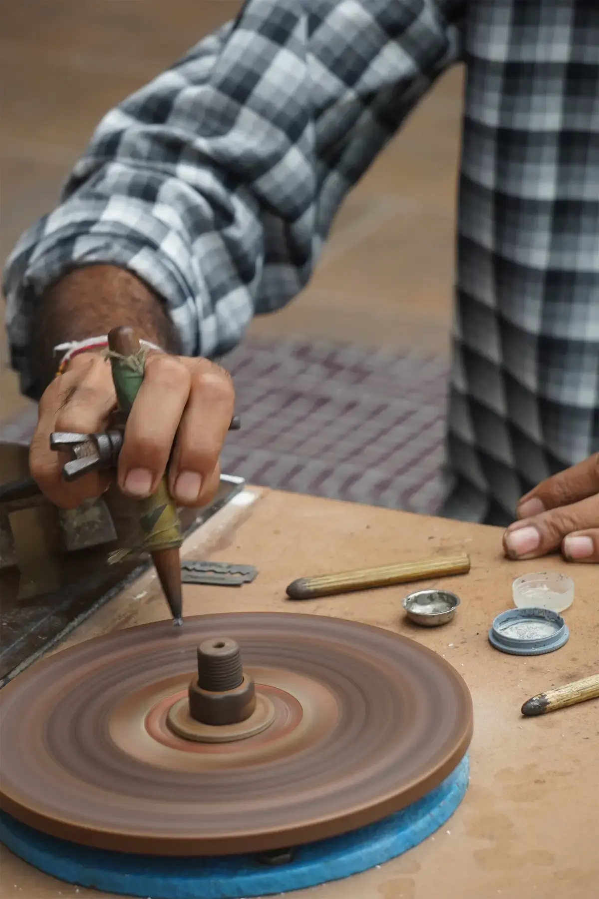 A stone being cut at the wheel