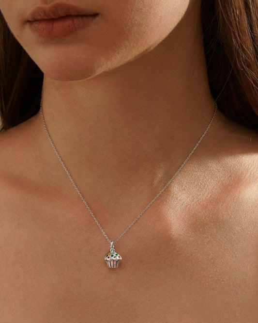 Woman wearing 925 silver cupcake necklace with cute cupcake pendant and positive message