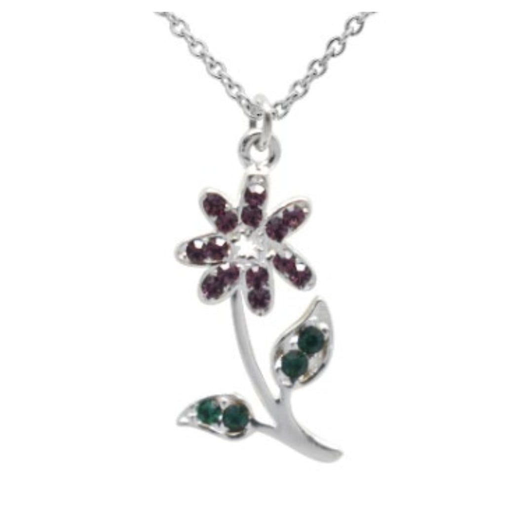 Close-up of delicate flower pendant with "Let your Dreams Bloom" message on 925 sterling silver necklace