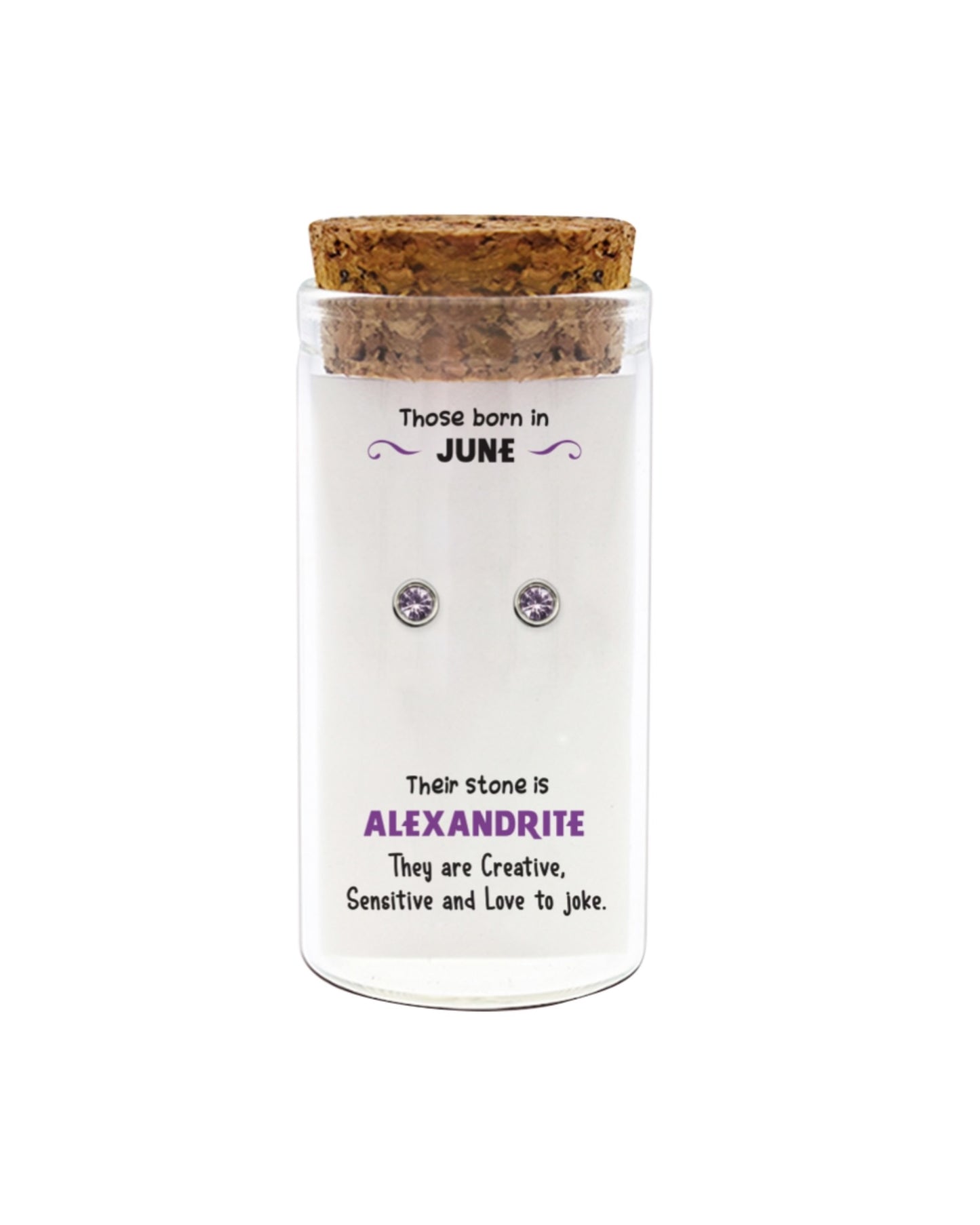 Cork-topped jar with Alexandrite earrings on a white background