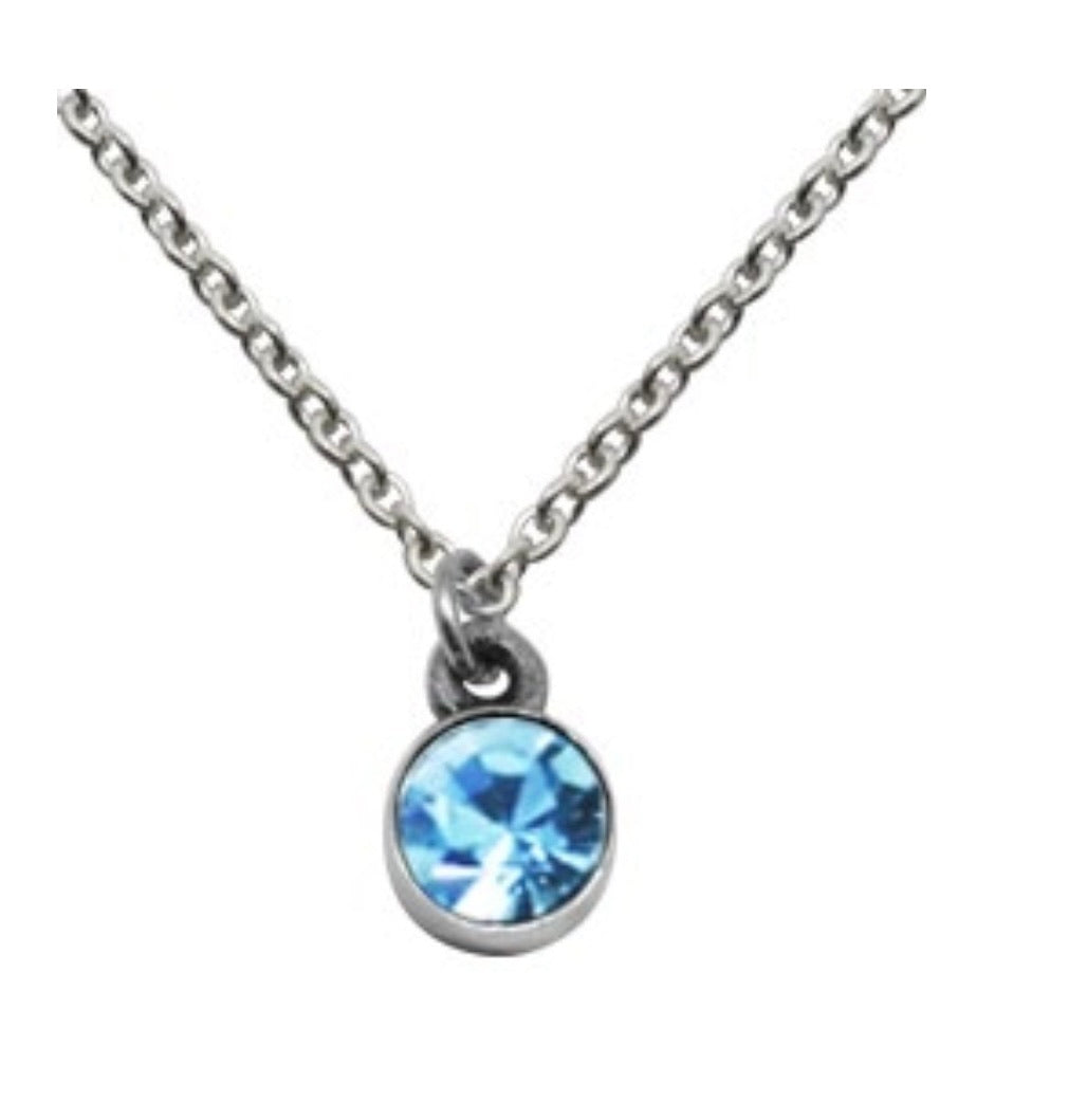 Close-up of sparkling birthstone pendant on 925 sterling silver chain