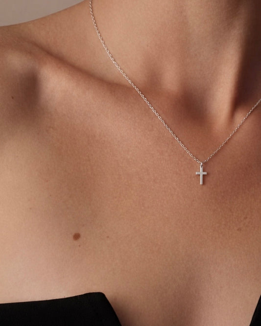 Model wearing cross necklace – simple Christian cross pendant