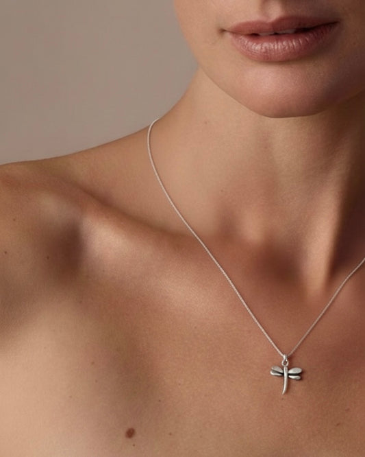 Woman wearing lucky dragonfly pendant necklace 925 silver – delicate nature jewelry on model