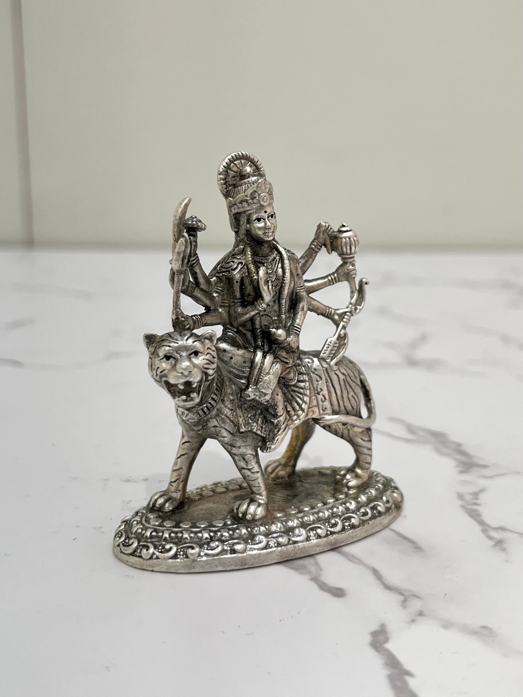 Side profile of 925 sterling silver Durga idol – intricate Tiger and weapons detailing