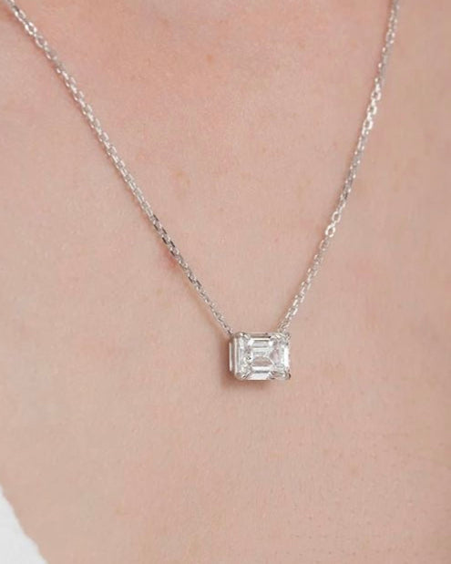 Emerald cut diamond necklace worn on neck – elegant gold diamond necklace