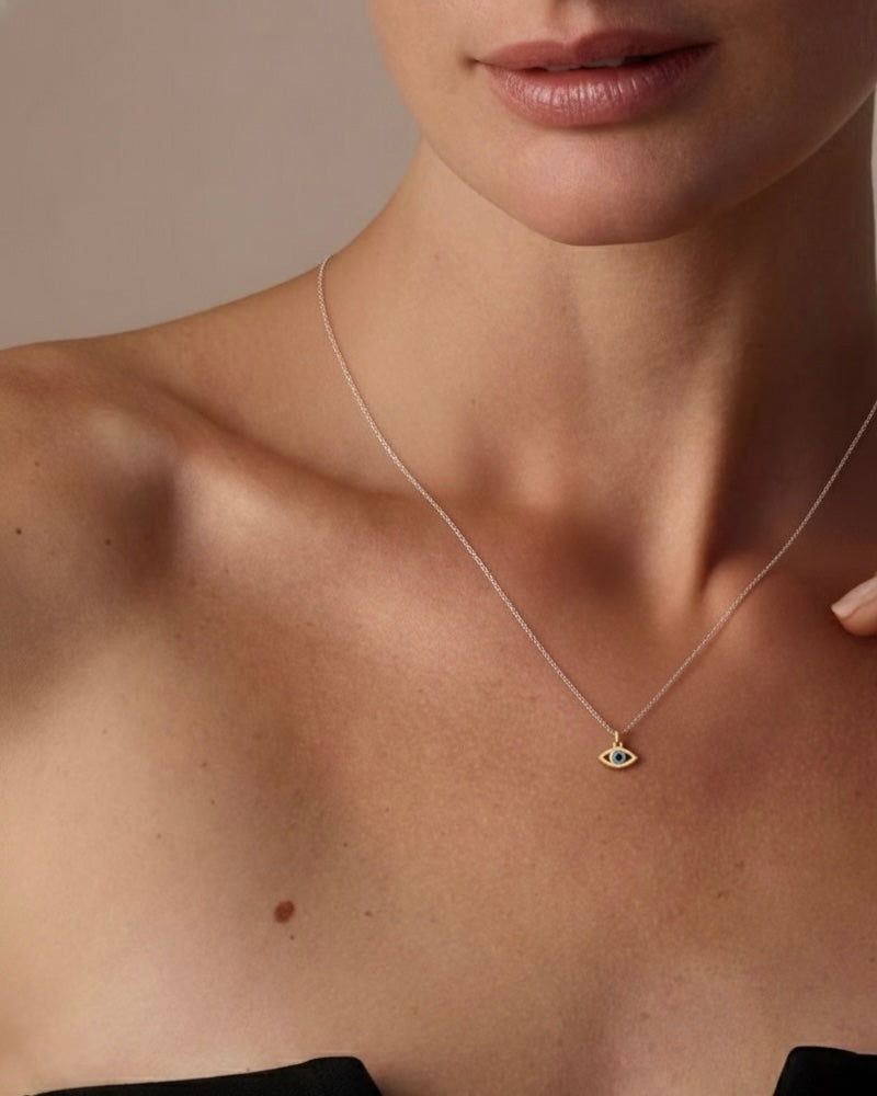 Woman wearing evil eye necklace "May Every Evil Eye Go Blind" 925 silver – protective jewelry on model