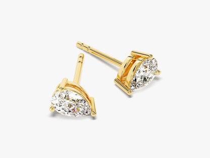 PEAR SOLITAIRE EARRINGS: Gold stud earrings with pear-shaped, clear VS2 clarity gemstones in simple prong settings, shown on a plain white background.