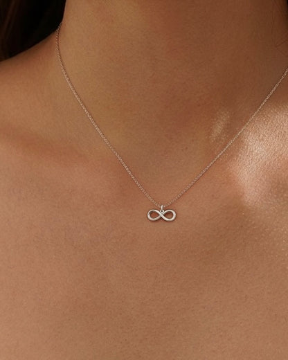 Model wearing "Forever" infinity necklace – elegant symbolic jewelry