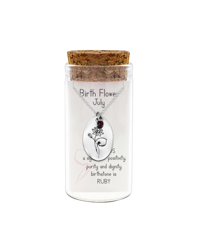 Necklace in a glass jar with cork lid, featuring a birthstone pendant for July.