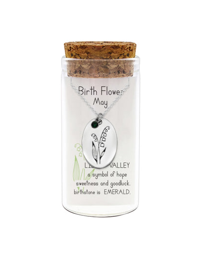 Necklace in a glass jar with cork lid, featuring a birth flower pendant for May.
