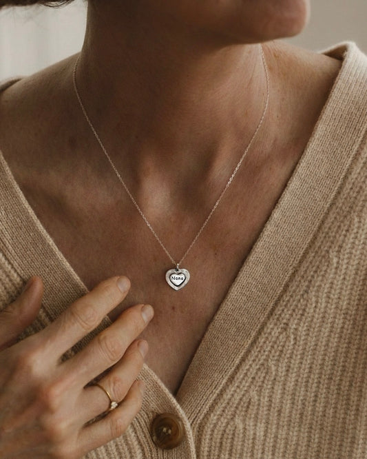 Woman wearing Nana heart pendant necklace 925 silver – meaningful family jewelry on model