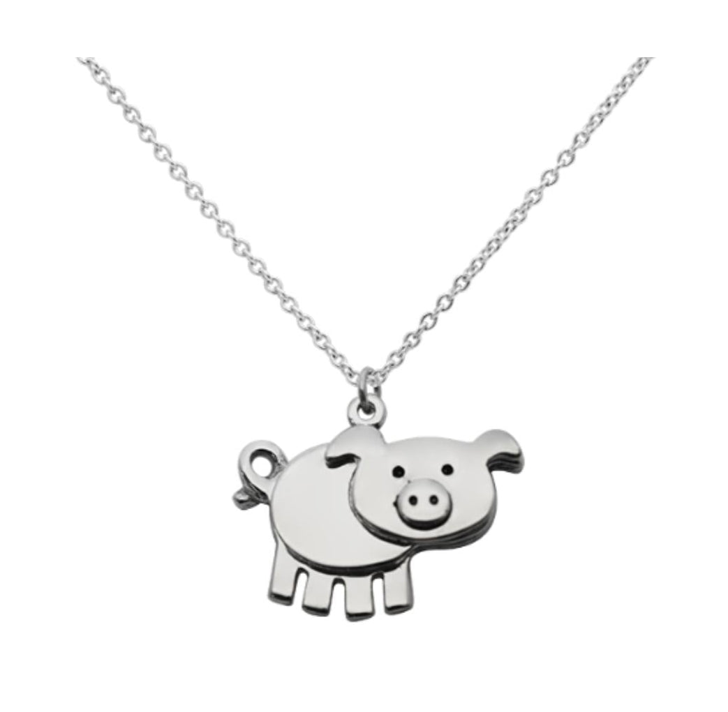 Close-up of pig pendant engraved "Miss You Pig Time" 925 silver – funny detail