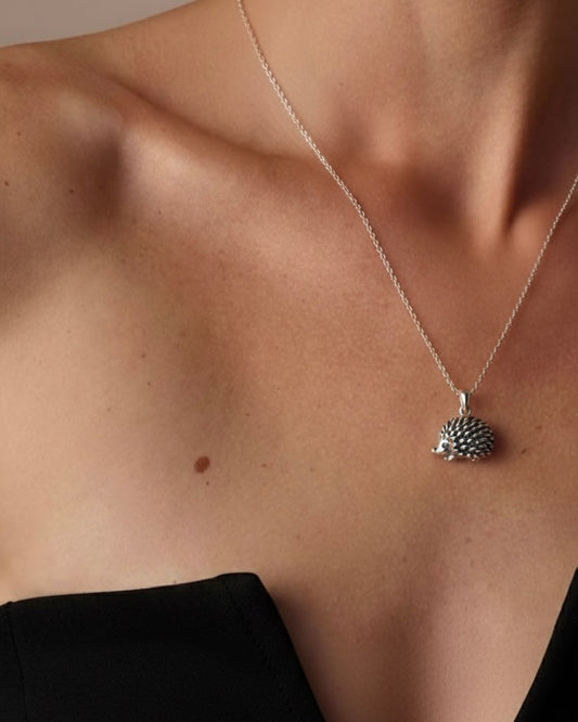Woman wearing fierce porcupine necklace "She Is Fierce" 925 silver – strong jewelry on model