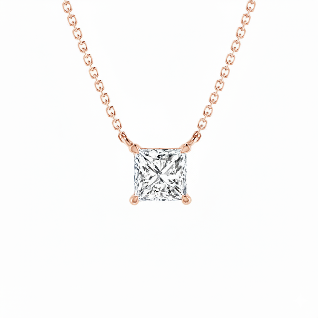 Rose gold necklace with a square-cut diamond pendant on a white background