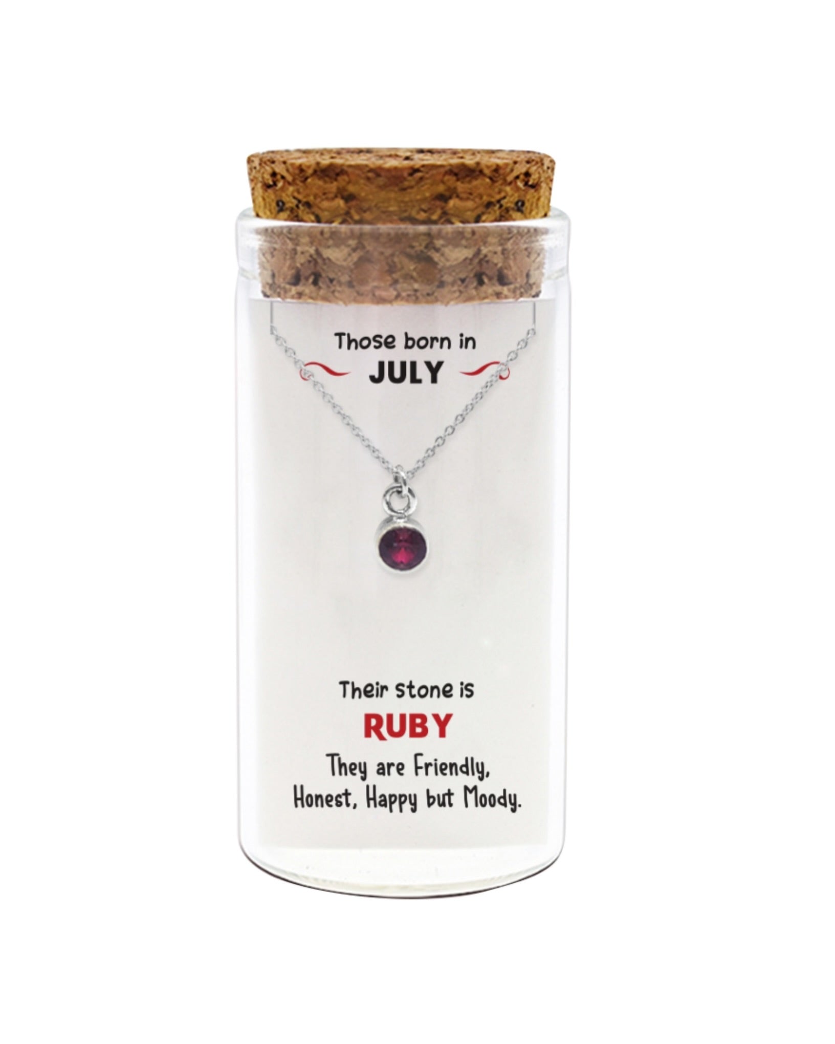 Necklace with a ruby stone in a glass jar with cork lid on a white background