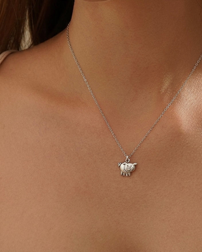 Woman wearing cute pig necklace "Miss You Pig Time" 925 silver – playful jewelry on model