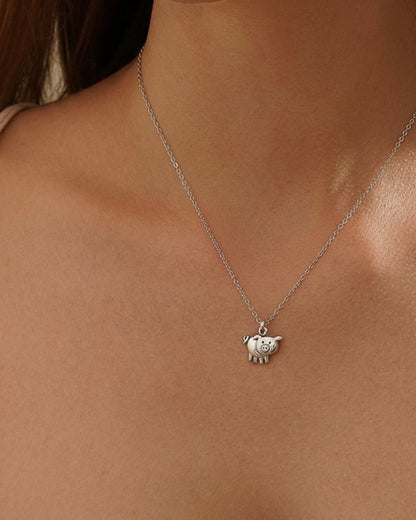 Woman wearing cute pig necklace "Miss You Pig Time" 925 silver – playful jewelry on model