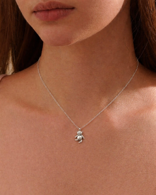 Woman wearing teddy bear pendant necklace 925 silver – adorable jewelry on model