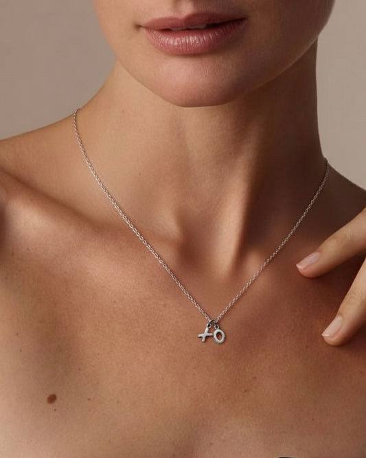 Model wearing XO charm necklace – adorable romantic jewelry