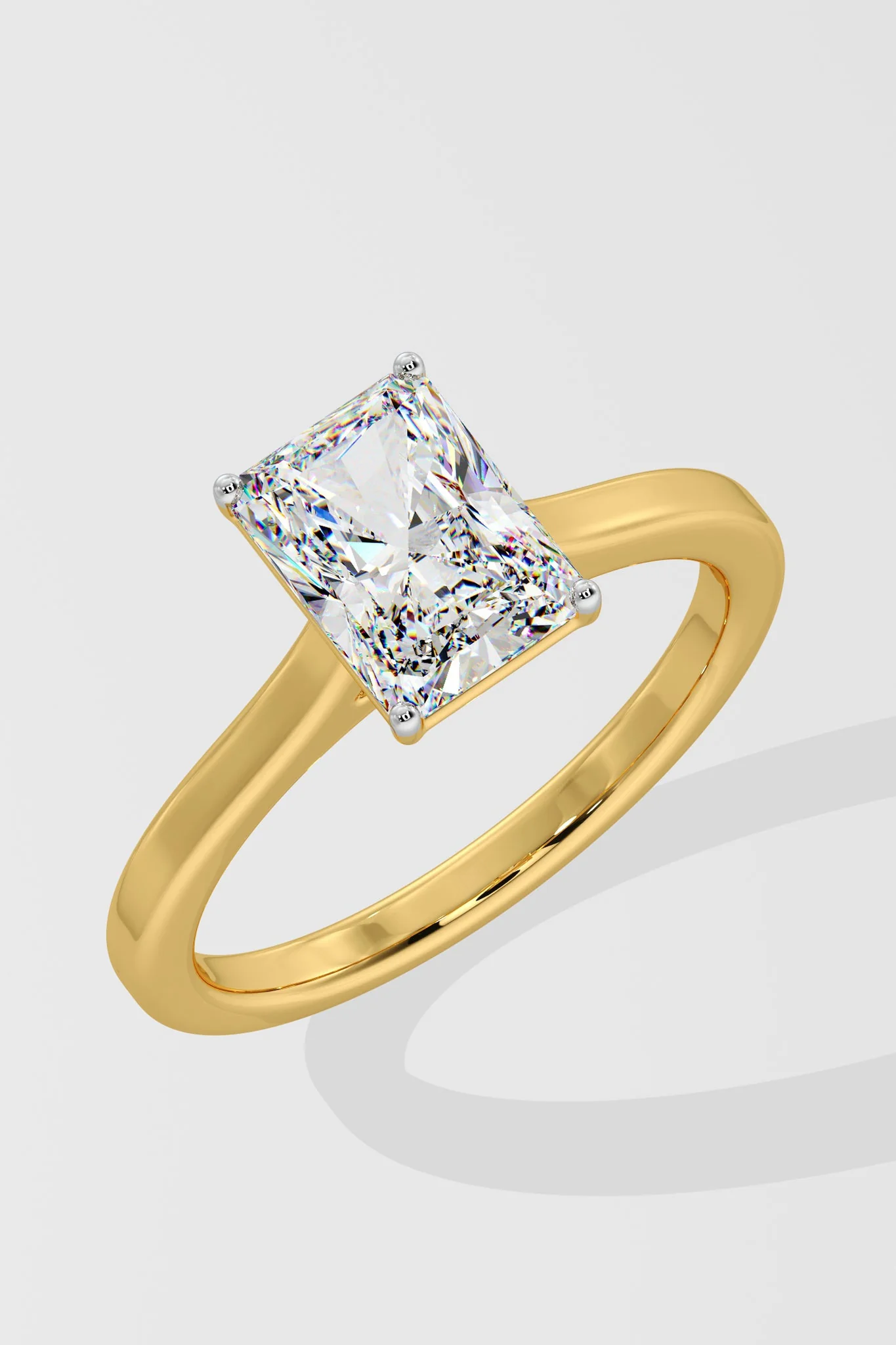 Close-up of Radiant cut lab-grown diamond (G Colour VS2 Clarity) and prong setting on solitaire ring