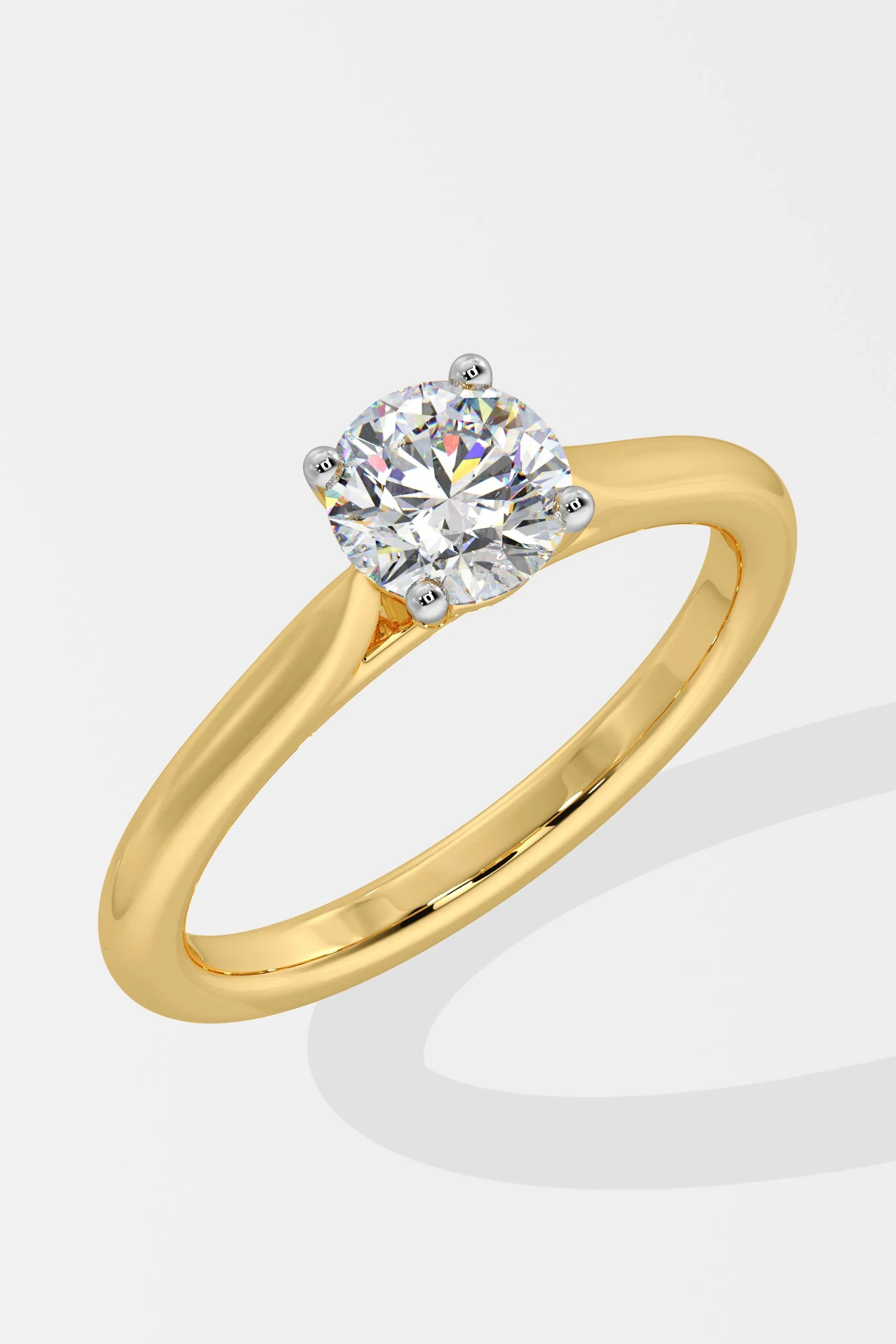 Gold ring with a diamond on a white background
