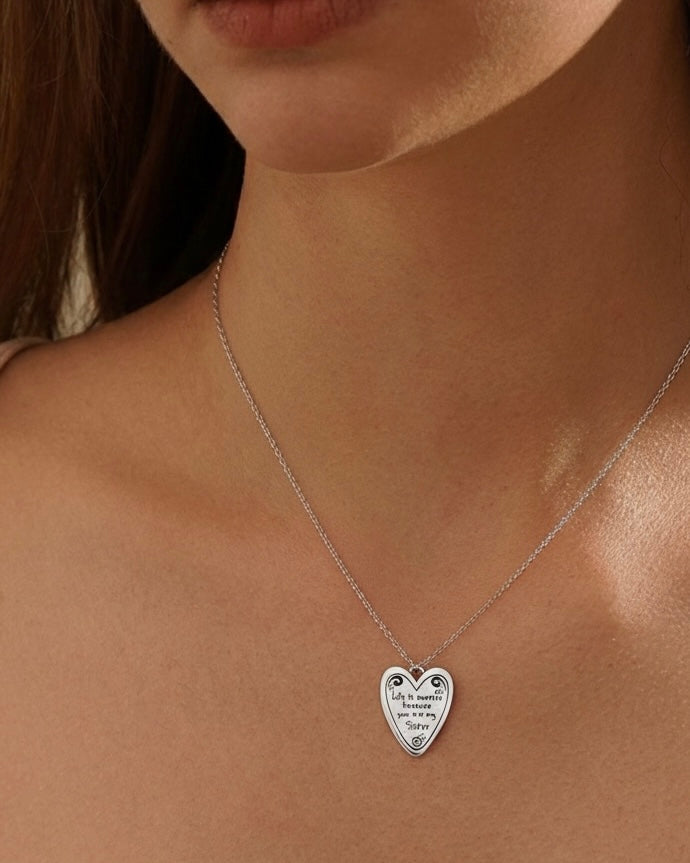 Model wearing sweet sister necklace – adorable heart charm