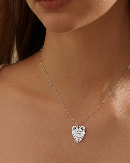 Model wearing sweet sister necklace – adorable heart charm
