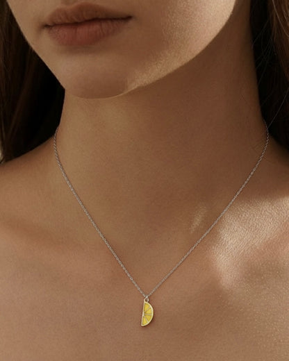 Model wearing lemon necklace – bright lemon pendant charm