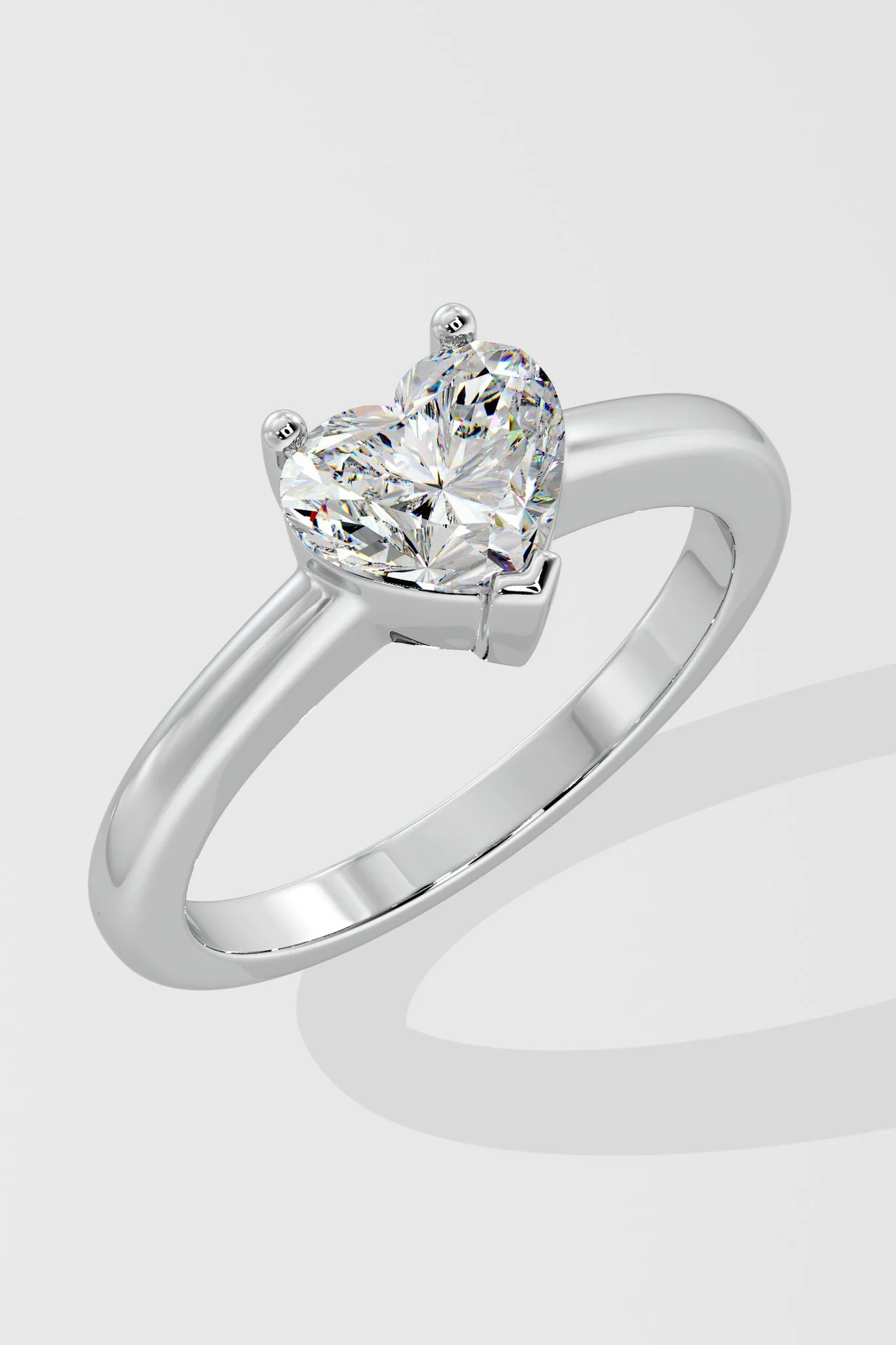 Close-up of Heart cut lab-grown diamond (G Colour VS2 Clarity) and prong setting on solitaire ring